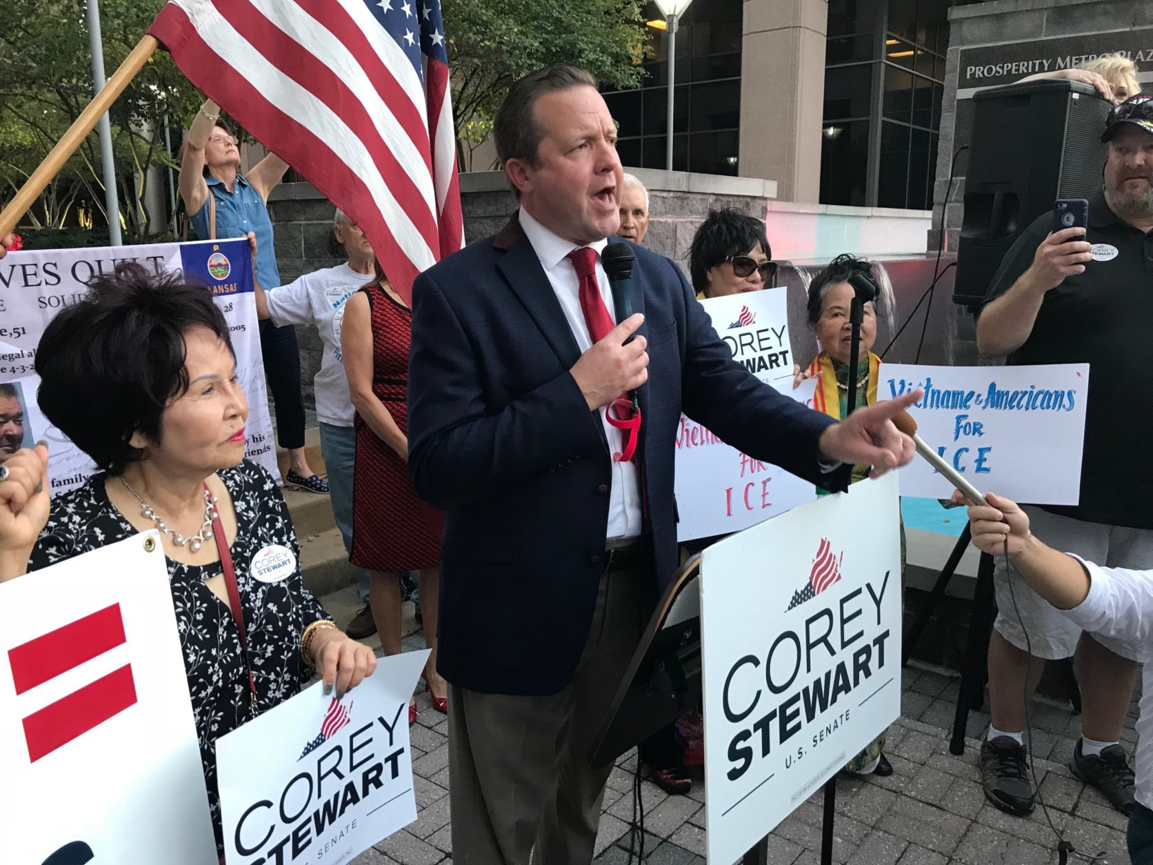 Republican Corey Stewart, who is running for U.S. Senate in Virginia, organized a pro-ICE rally in Fairfax, Virginia, on Tuesday, Oct. 9, 2018. The rally also attracted protesters. (WTOP/Michelle Basch)