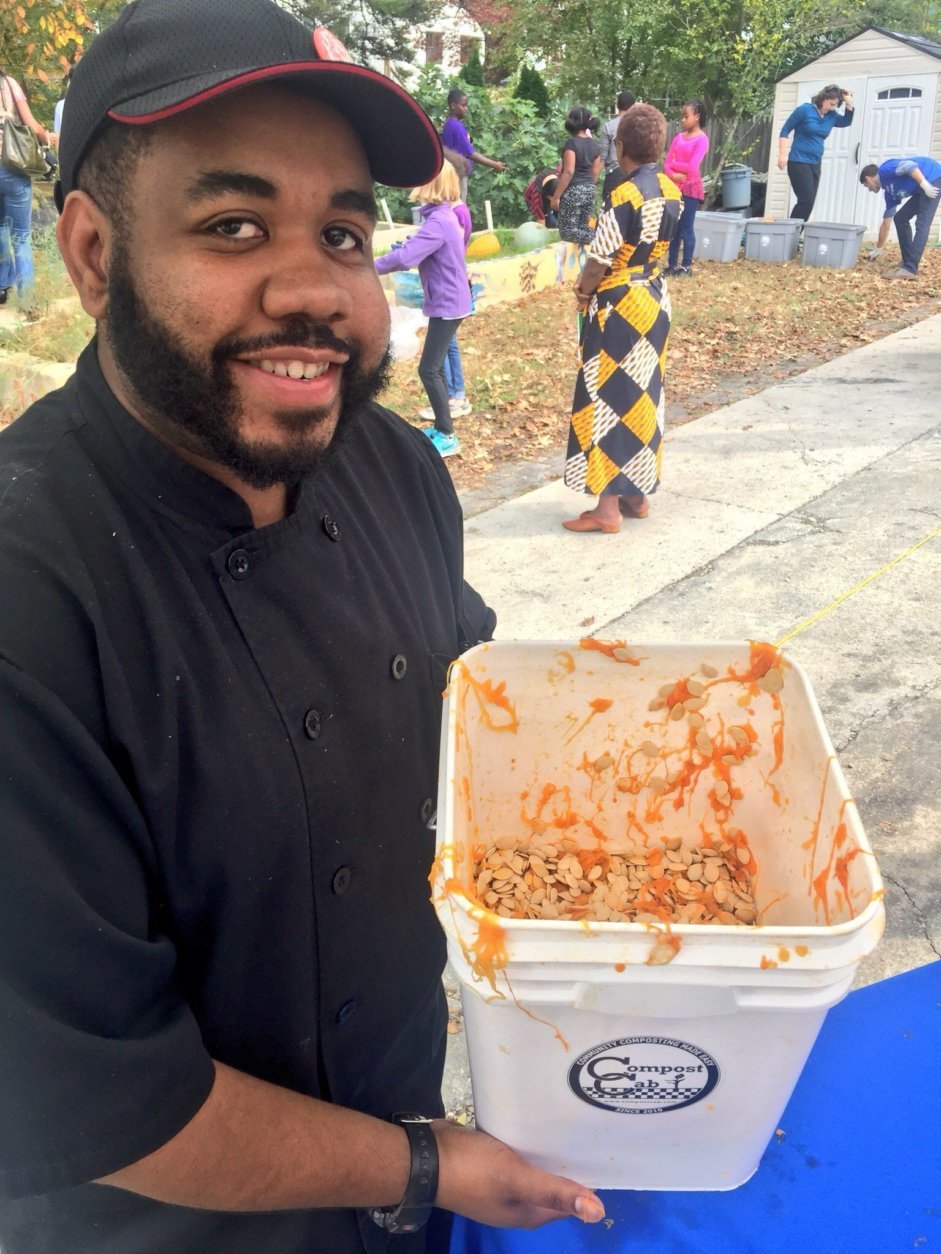 Chef at EW Stokes Public Charter School with seeds recovered during Pumpkins for the People 2017. (Courtesy Agricity) 