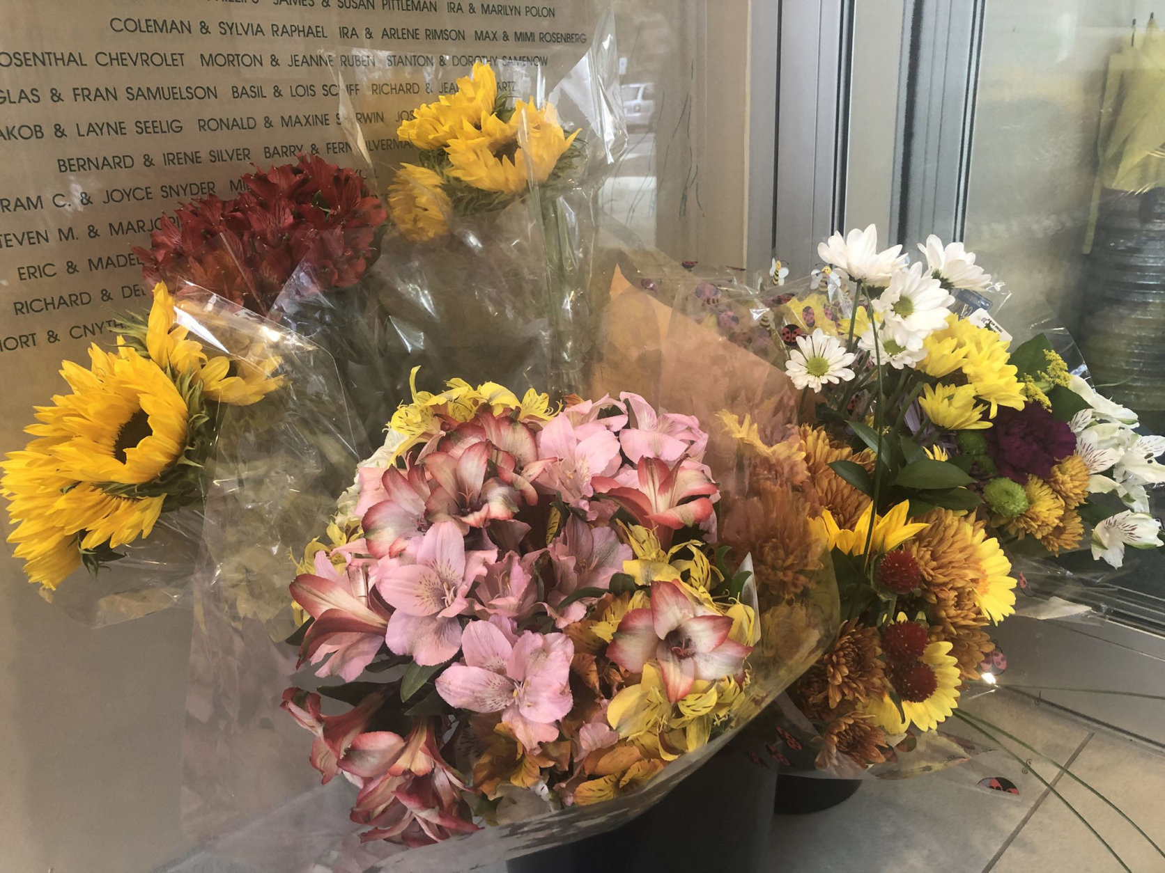 Flowers are being delivered to the Jewish Community Center of Northern Virginia, in Annandale, two days after swastikas were spray-painted on the building. (WTOP/Melissa Howell)
