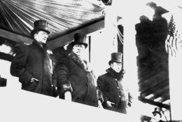 William Howard Taft, center, wore big fur-lined overcoat when he reviewed parade after his inauguration as president, on March 4, 1909 in Washington.  At right is James S. Sherman, vice president of the United States, and at left Edward Hallwagon, chief of the Inaugural Committee.    A whirling blizzard, featured by flashes of lighting, as well as rain, snow and a cutting wind, made it one of the roughest of all inauguration days. (AP Photo)