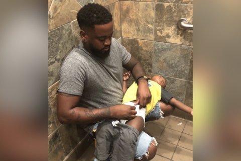 Photo shows how diaper-changing stations in men’s restrooms are still too rare