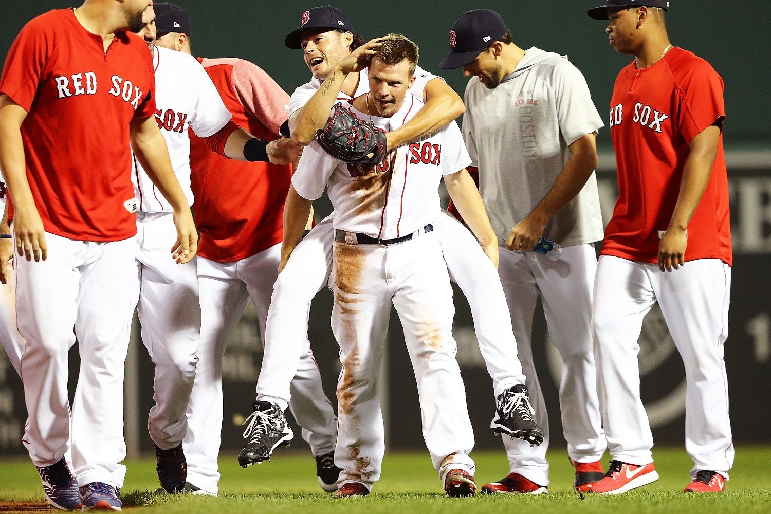 BOSTON, MA - AUGUST 06:  Tony Renda #38 of the Boston Red Sox who scored the game-winning run gives a piggy back ride to Joe Kelly #56 of the Boston Red Sox after a victory over the New York Yankees at Fenway Park on August 6, 2018 in Boston, Massachusetts.  (Photo by Adam Glanzman/Getty Images)
