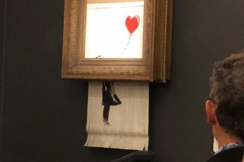 Banksy painting ‘self-destructs’ moments after being sold for $1.4 million at auction