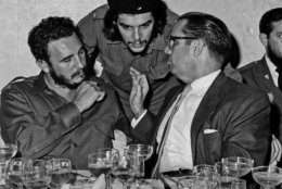 FILE - In this 1960 file photo, Cuba's revolutionary hero Ernesto "Che" Guevara, center, Cuba's leader Fidel Castro, left, and Cuba's President Osvaldo Dorticos, right, attend a reception in an unknown location in Cuba. Former President Fidel Castro, who led a rebel army to improbable victory in Cuba, embraced Soviet-style communism and defied the power of 10 U.S. presidents during his half century rule, has died at age 90. The bearded revolutionary, who survived a crippling U.S. trade embargo as well as dozens, possibly hundreds, of assassination plots, died eight years after ill health forced him to formally hand power over to his younger brother Raul, who announced his death late Friday, Nov. 25, 2016, on state television. (Prensa Latina via AP Images, File)
