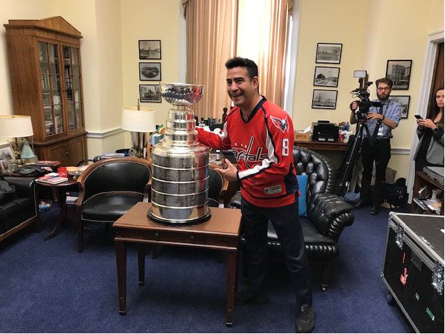 Alfredo Flores, who saw the Caps lose to the Red Wings in the 1998 Stanley Cup finals, says it’s “thrilling” to see the cup in D.C. 20 years later. (WTOP/Mitch Miller)