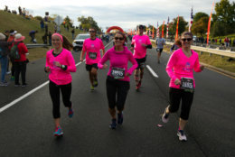 Women wearing pink start the Marine Corps Marathon on Sunday morning. (AP Photo/Jose Luis Magana)