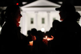 People gather outside the White House for a vigil after a gunman open fired at a Pittsburgh synagogue on Saturday, Oct. 27, 2018. (WTOP/Kate Ryan)