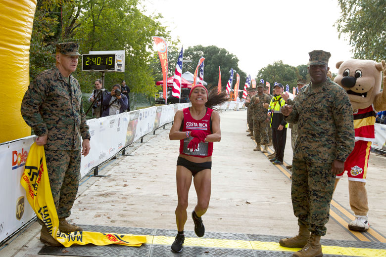 Jenny Mendez of Costa Rica crosses the finish line in first place in the women's division of the 43rd Marine Corps Marathon, Sunday, Oct. 28, 2018, in Arlington, Va. (AP Photo/Jose Luis Magana)