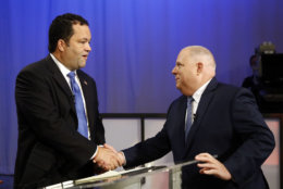Maryland Democratic gubernatorial candidate Ben Jealous, left, and Republican candidate, Maryland Gov. Larry Hogan, shake hands before participating in a debate Monday, Sept. 24, 2018, at Maryland Public Television's studios in Owings Mills, Md. (AP Photo/Patrick Semansky)