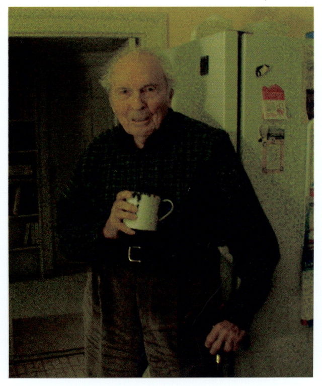 Frank Woodruff Buckles holds the chipped metal cup he used during his 39-month internment in Japanese prison camps. (Veterans History Project Collection, American Folklife Center, Library of Congress)