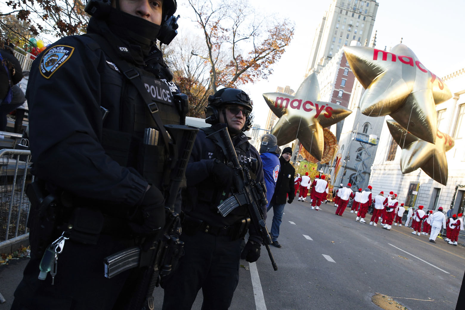 Members of the New York Police Department take a position along the route before the start of the 92nd annual Macy's Thanksgiving Day Parade in New York, Thursday, Nov. 22, 2018. (AP Photo/Eduardo Munoz Alvarez)