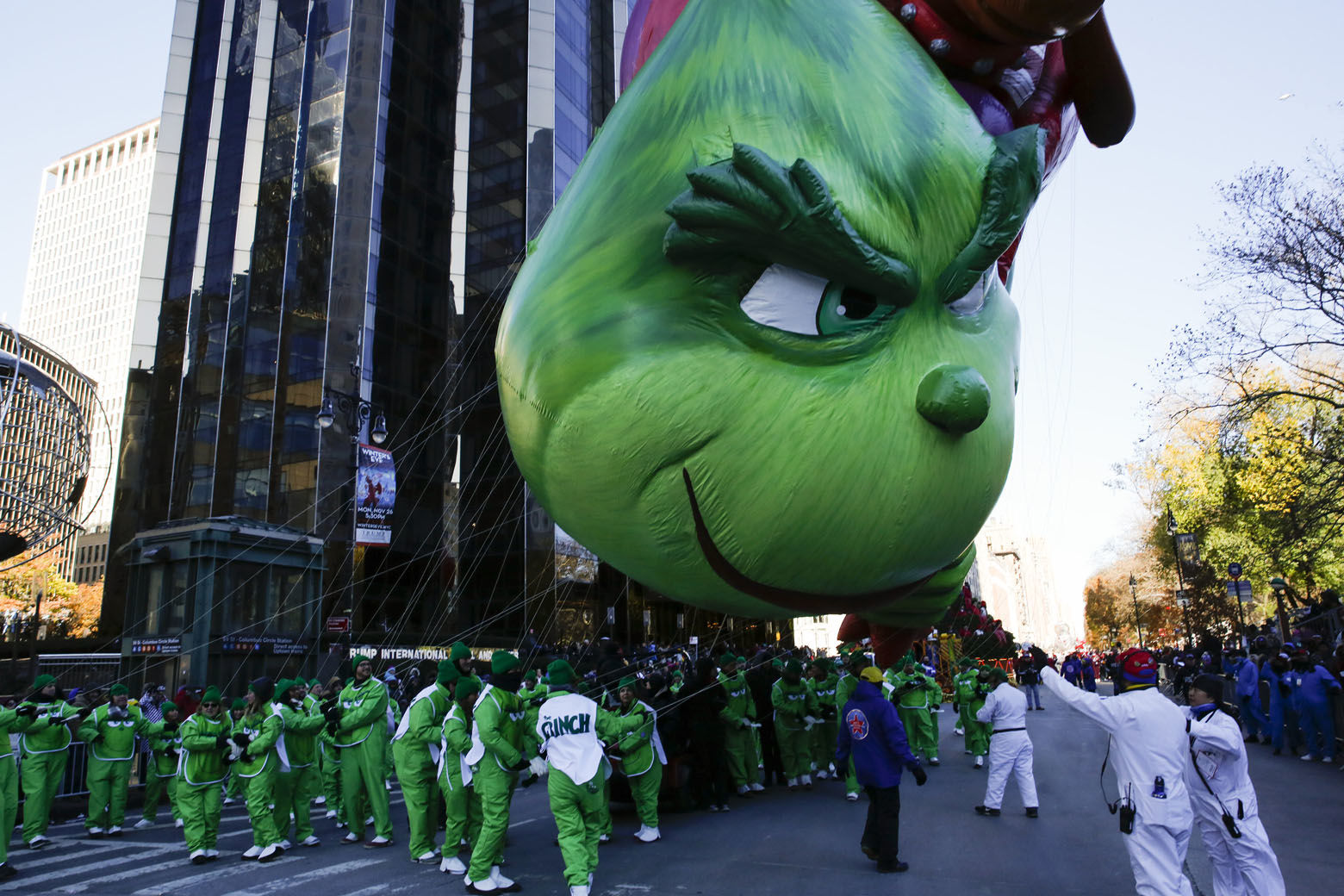 Performers fight to hold their position on The Grinch balloon as it floats over Central Park West during the 92nd annual Macy's Thanksgiving Day Parade in New York, Thursday, Nov. 22, 2018. (AP Photo/Eduardo Munoz Alvarez)