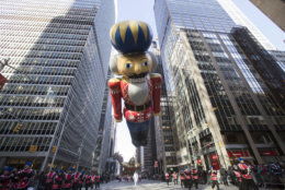 A nutcracker soldier balloon floats down 6th Avenue during the 92nd annual Macy's Thanksgiving Day Parade, Thursday, Nov. 22, 2018, in New York. (AP Photo/Mary Altaffer)