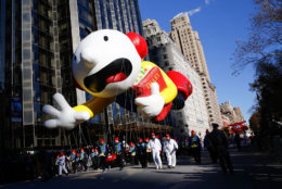 Greg Heffley from the "Diary of a Wimpy Kid" series balloon passes by windows of a building on Central Park West during the 92nd annual Macy's Thanksgiving Day Parade in New York, Thursday, Nov. 22, 2018. (AP Photo/Eduardo Munoz Alvarez)