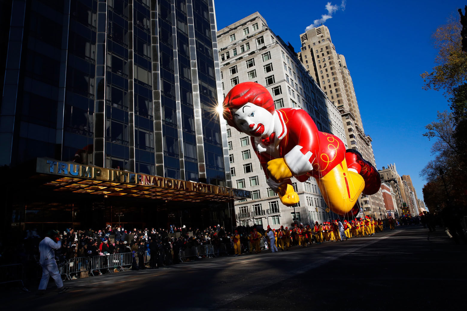 The Ronald McDonald balloon passes by windows of a building on Central Park West during the 92nd annual Macy's Thanksgiving Day Parade in New York, Thursday, Nov. 22, 2018. (AP Photo/Eduardo Munoz Alvarez)