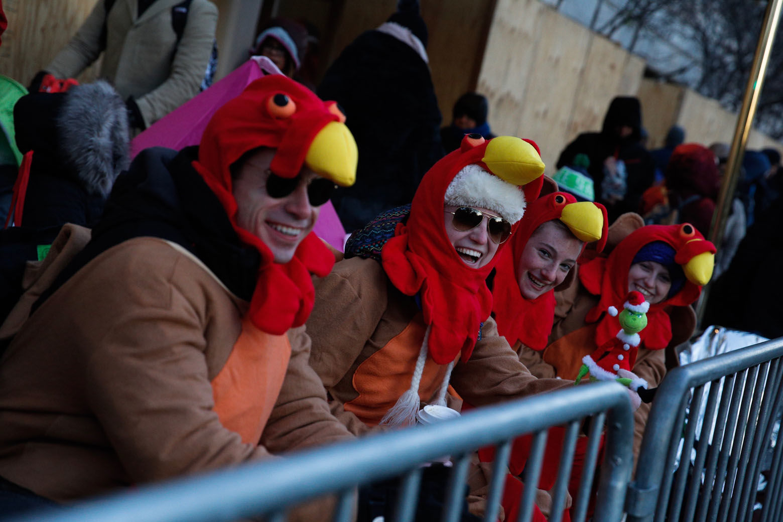 People try to stay warm before the 92nd annual Macy's Thanksgiving Day Parade in New York, Thursday, Nov. 22, 2018. (AP Photo/Eduardo Munoz Alvarez)