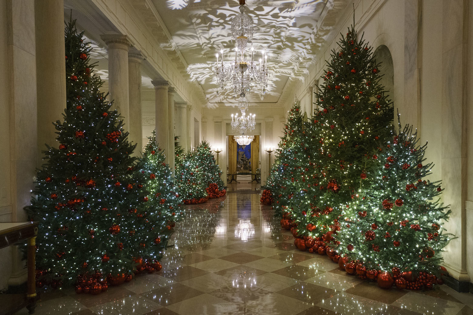 The Cross Hall is seen during the 2018 Christmas Press Preview at the White House in Washington, Monday, Nov. 26, 2018. Christmas has arrived at the White House. First lady Melania Trump unveiled the 2018 White House holiday decor on Monday. She designed the decor, which features a theme of "American Treasures." (AP Photo/Carolyn Kaster)