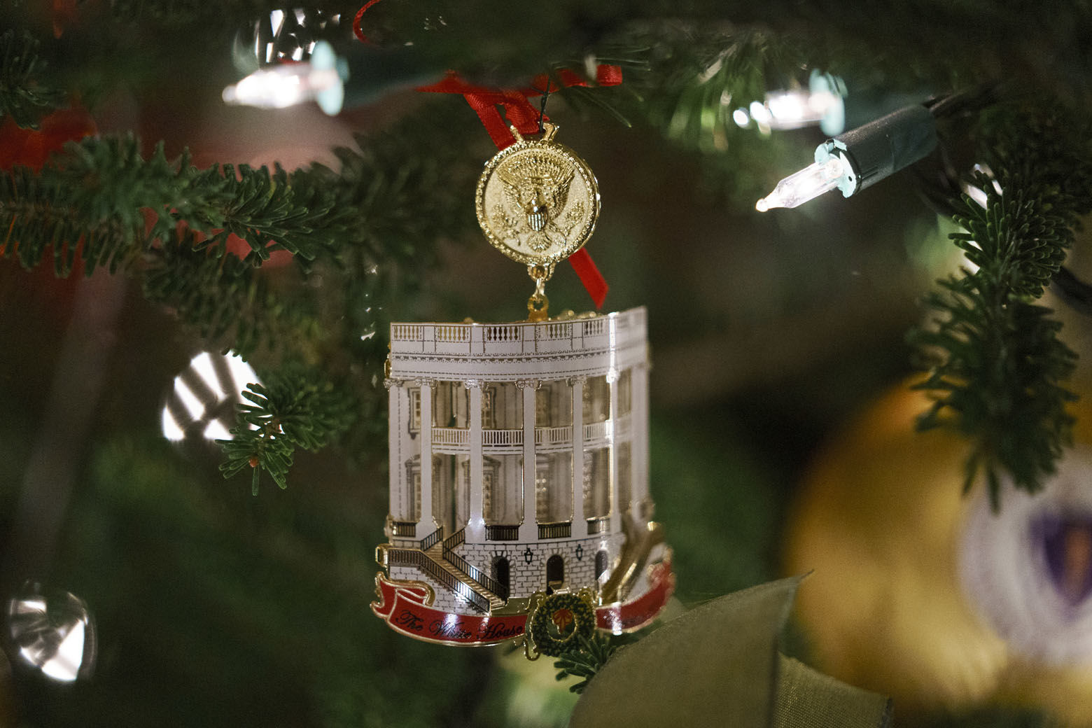 The Official 2018 White House Christmas Ornament is seen during the 2018 Christmas Press Preview at the White House in Washington, Monday, Nov. 26, 2018. Christmas has arrived at the White House. First lady Melania Trump unveiled the 2018 White House holiday decor on Monday. She designed the decor, which features a theme of "American Treasures." (AP Photo/Carolyn Kaster)
