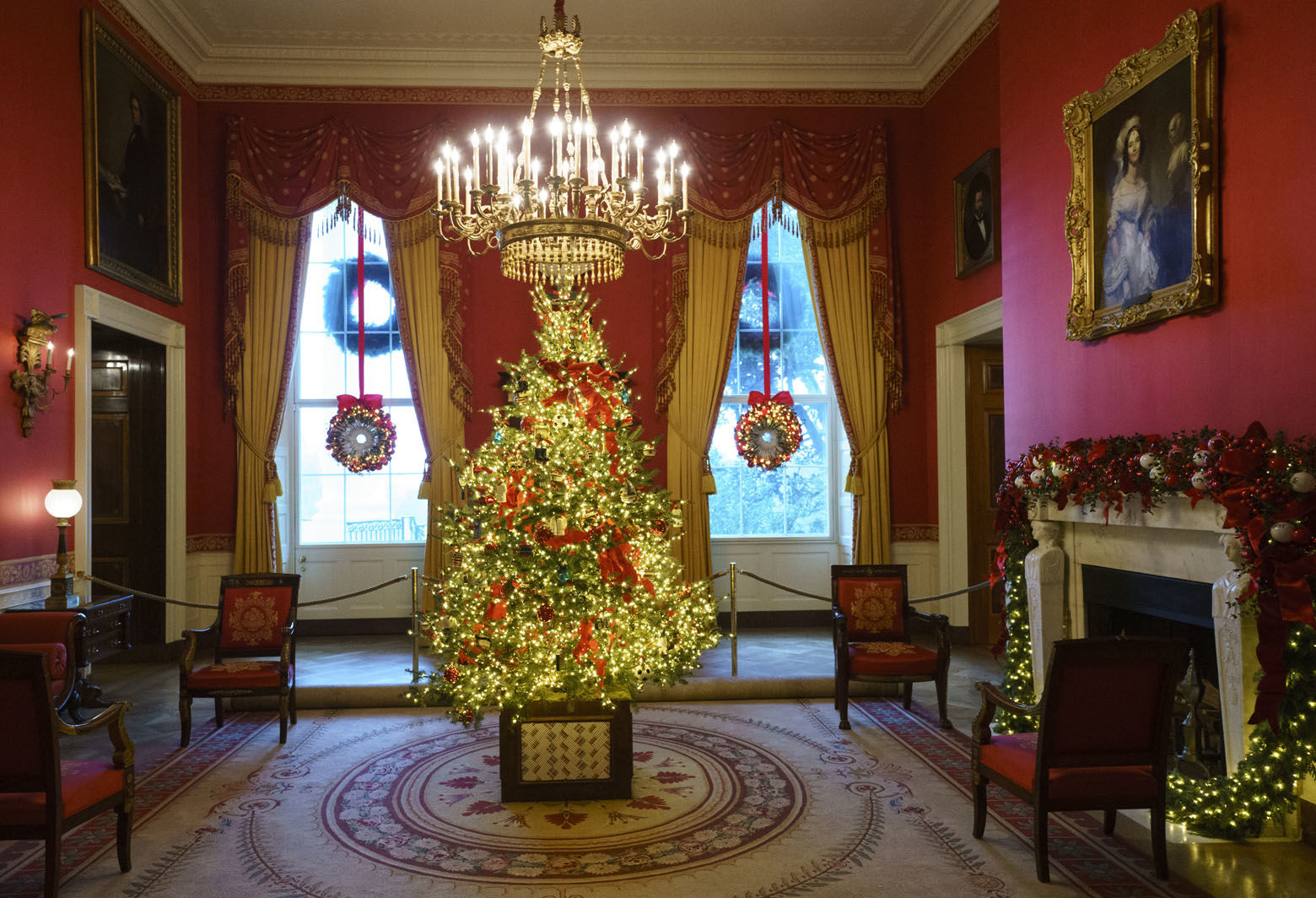 The Red Room, with the theme to celebrate America's Children, is seen during the 2018 Christmas preview at the White House in Washington, Monday, Nov. 26, 2018.  (AP Photo/Carolyn Kaster)