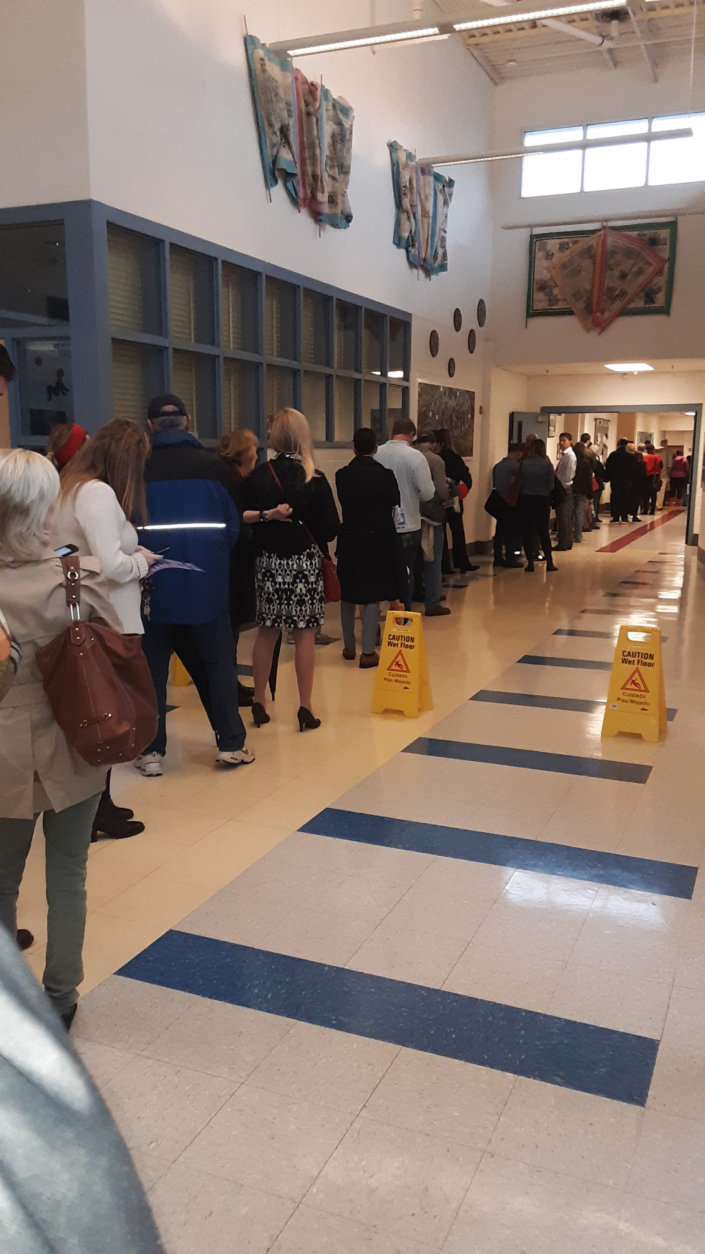 A line of voters wait to cast their votes at the poll at Bethesda Elementary in Montgomery County, Maryland. (WTOP/Lisa Weiner)