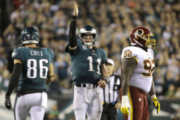 FILE - In this Monday, Oct. 23, 2017, file photo, Philadelphia Eagles quarterback Carson Wentz (11) gestures after scrambling for yardage against the Washington Redskins during the second half of an NFL football game in Philadelphia. Wentz and the Philadelphia Eagles are the talk of the NFL following a surprising 6-1 start and impressive victories in consecutive prime-time games.  (AP Photo/Michael Perez, File)