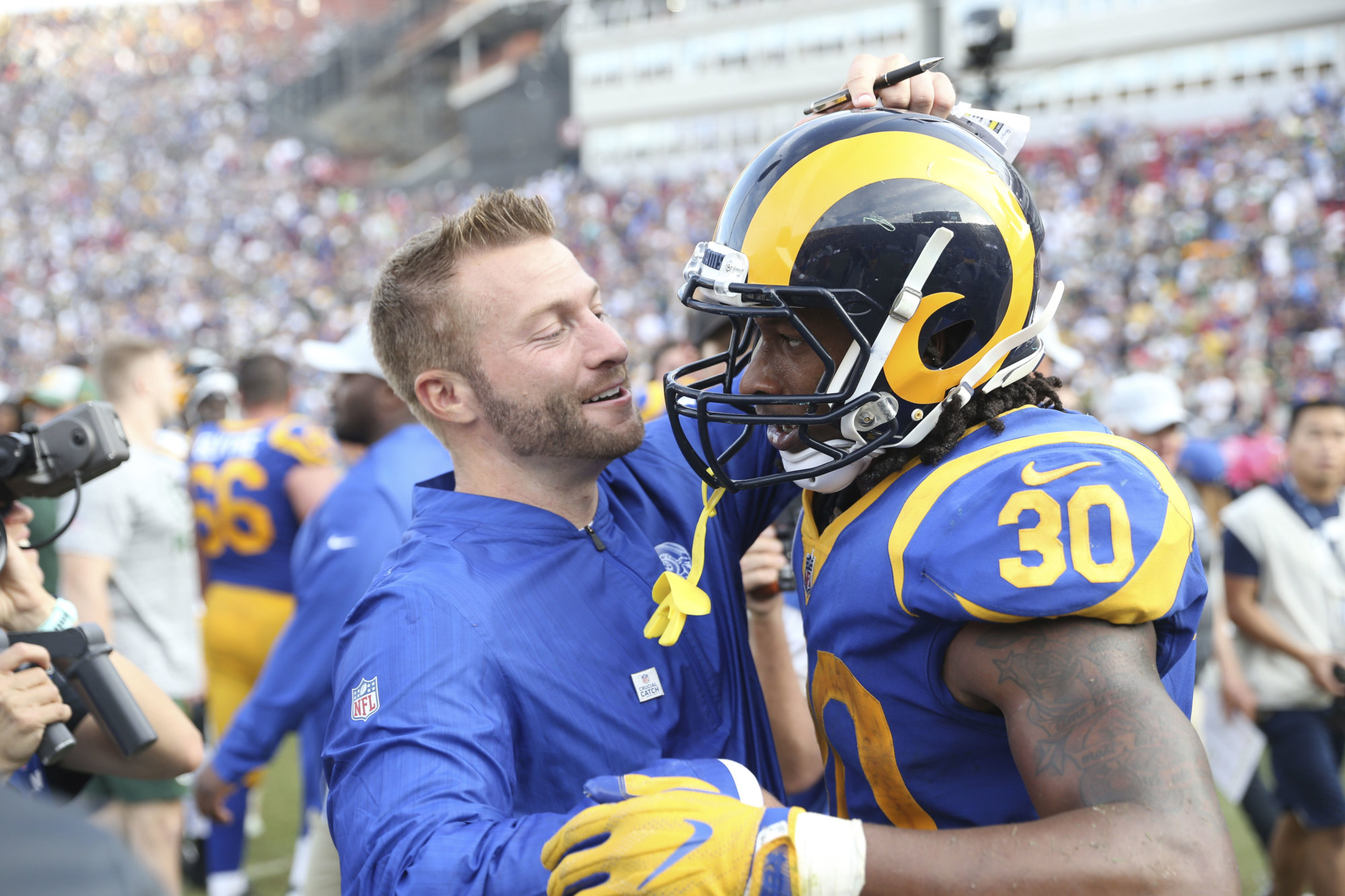 Los Angeles Rams running back Todd Gurley (30) gets a hug after the game from Los Angeles Rams head coach Sean McVay of an NFL football game, Sunday, Oct. 28, 2018, in Los Angeles. (AP Photo/Peter Joneleit)