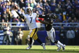 Pittsburgh Steelers quarterback Ben Roethlisberger (7) throws a pass as he tries to avoid Baltimore Ravens outside linebacker Matt Judon in the first half of an NFL football game, Sunday, Nov. 4, 2018, in Baltimore. (AP Photo/Gail Burton)a