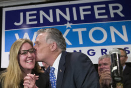 Democrat Jennifer Wexton, left, smiles as former Virginia Gov. Terry McAuliffe gives her a kiss at her election night party after defeating Rep. Barbara Comstock, R-Va., Tuesday, Nov. 6, 2018, in Dulles, Va. (AP Photo/Alex Brandon)