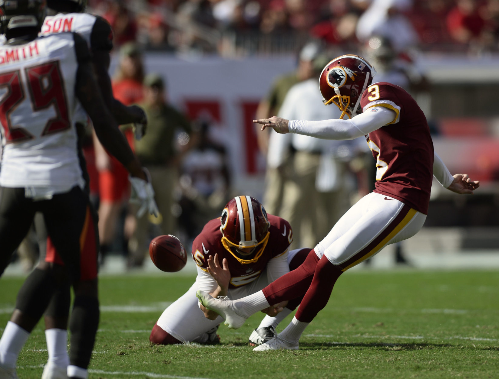 Washington Redskins' Dustin Hopkins (3) kicks a field goal against the Tampa Bay Buccaneers during the first half of an NFL football game Sunday, Nov. 11, 2018, in Tampa, Fla. (AP Photo/Jason Behnken)