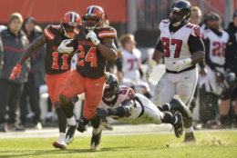 Cleveland Browns running back Nick Chubb (24) rushes for a 92-yard touchdown as Atlanta Falcons linebacker Foye Oluokun (54) misses the tackle in the second half of an NFL football game, Sunday, Nov. 11, 2018, in Cleveland. (AP Photo/David Richard)