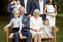 In this handout image provided by Clarence House and taken on Sept. 5, 2018, Britain's Prince Charles poses for an official portrait to mark his 70th Birthday in the gardens of Clarence House, with Camilla, Duchess of Cornwall, Prince William, Kate, Duchess of Cambridge, Prince George, Princess Charlotte, Prince Louis, Prince Harry and Meghan, Duchess of Sussex, in London, England. (Chris Jackson/Pool Photo)