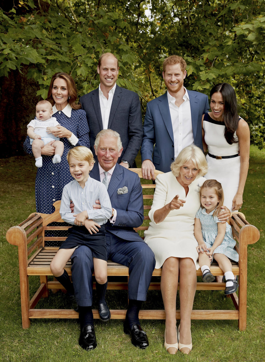 In this handout image provided by Clarence House and taken on Sept. 5, 2018, Britain's Prince Charles poses for an official portrait to mark his 70th Birthday in the gardens of Clarence House, with Camilla, Duchess of Cornwall, Prince William, Kate, Duchess of Cambridge, Prince George, Princess Charlotte, Prince Louis, Prince Harry and Meghan, Duchess of Sussex, in London, England. (Chris Jackson/Pool Photo)