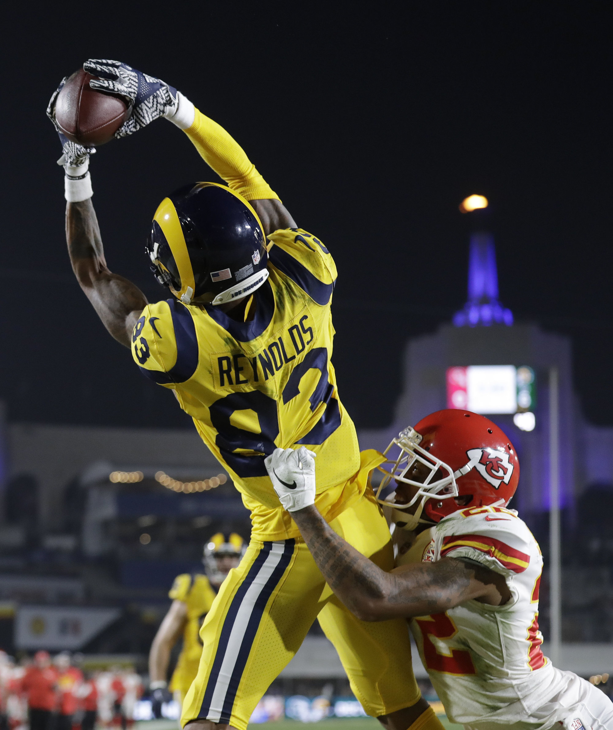 Los Angeles Rams wide receiver Josh Reynolds (83) catches a touchdown pass over Kansas City Chiefs defensive back Orlando Scandrick, lower right, during the first half of an NFL football game Monday, Nov. 19, 2018, in Los Angeles. (AP Photo/Marcio Jose Sanchez)