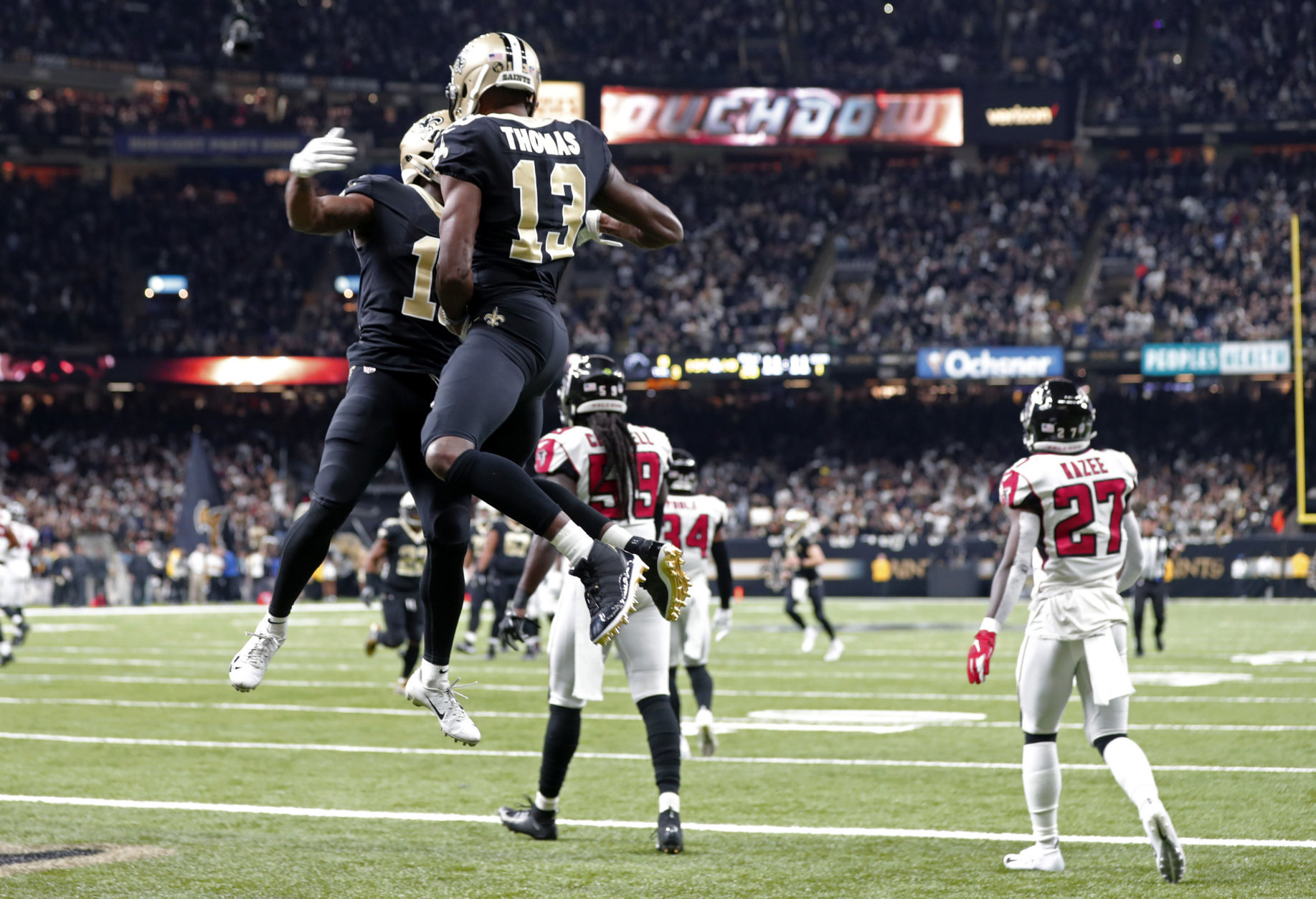New Orleans Saints wide receiver Tommylee Lewis celebrates his touchdown reception with wide receiver Michael Thomas (13) in the first half of an NFL football game against the Atlanta Falcons in New Orleans, Thursday, Nov. 22, 2018. (AP Photo/Gerald Herbert)