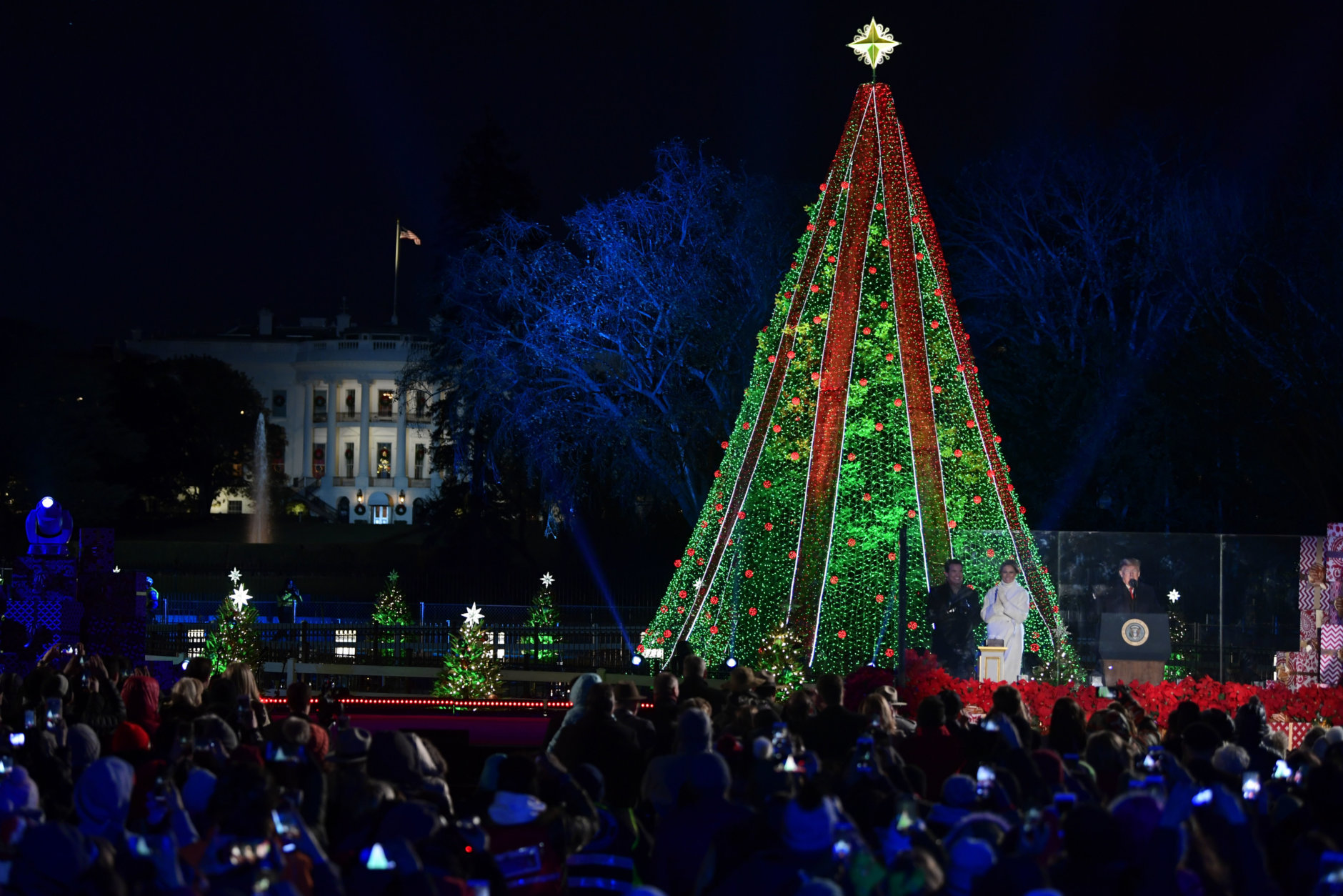 President Donald Trump and first lady Melania Trump light the National Christmas Tree on the Ellipse near the White House in Washington, Wednesday, Nov. 28, 2018. (AP Photo/Susan Walsh)