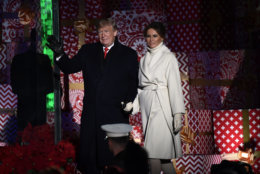 President Donald Trump and first lady Melania Trump wave after lighting the National Christmas Tree on the Ellipse near the White House in Washington, Wednesday, Nov. 28, 2018. (AP Photo/Susan Walsh)