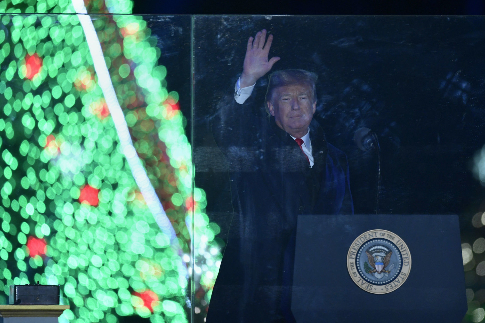 President Donald Trump waves at the annual National Christmas Tree Lighting on the Ellipse in Washington, Wednesday, Nov. 28, 2018. (AP Photo/Susan Walsh)