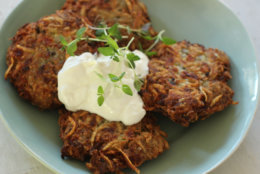 This Oct. 19, 2015 photo shows zesty zucchini and feta latkes in Concord, N.H. This dish is from a recipe by Alison Ladman. (AP Photo/Matthew Mead)
