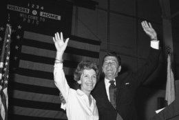 Former California Governor Ronald Reagan, Republican candidate for President, and his wife Nancy, raise their arms in response to loud applause as they stand on the podium, March 8, 1976 in Lake Worth, Fla. The rally for Reagan, was held at the Palm Beach Junior College. (AP Photo/Robert H. Houston)
