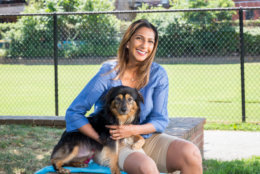 Anu Rangappa, director of the mayor's communications office, gets to know Georgie, who's also up for adoption at the alliance. (Courtesy Humane Rescue Alliance)