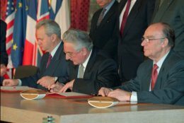 Balkan leaders from the left: Slobodan Milosevic, Serbia, Franjo Tudjman, Croatia, and Alija Izetbegovic, Bosnia, during the signing of the treaty to forge an end to Europe's most devastating conflict since WWII, in the Elysee Palace in Paris Thursday December 14, 1995.(AP PHOTO/Jerome Delay/pool)