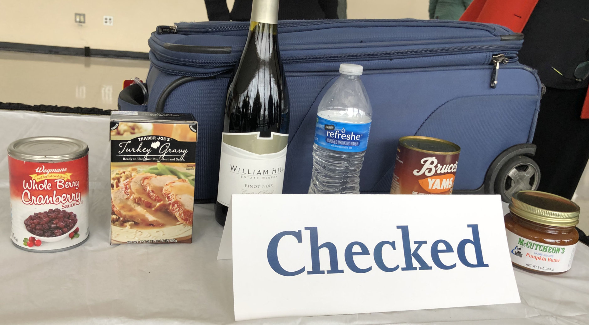 A collection of items that have to be in checked baggage if you're trying to bring them aboard an airplane. (WTOP/Kristi King)