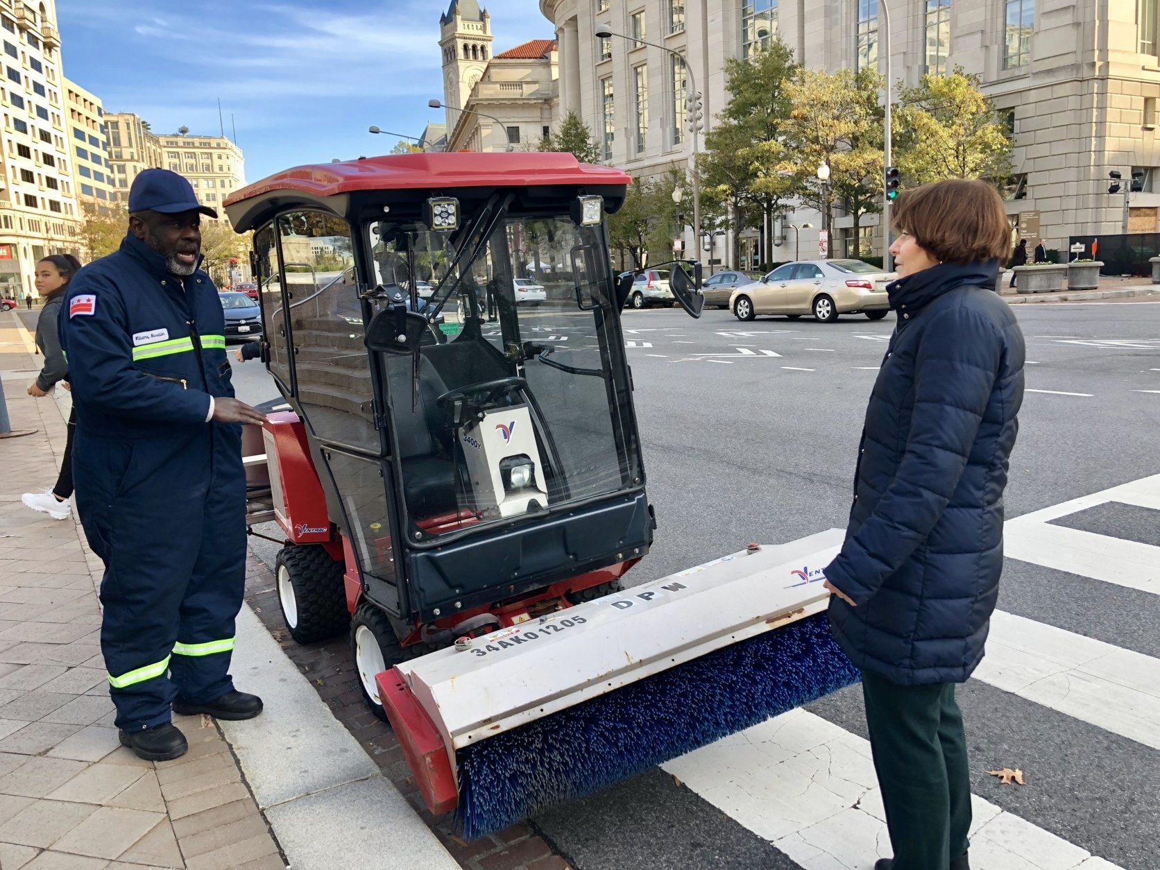 Nevelion Williams of D.C.'s Department of Public Works briefs D.C. Council Committee on Transportation and the Environment chair Mary Cheh on newly purchased snow removal equipment. It's called a Ventrac. (Courtesy Kelly Whittier)