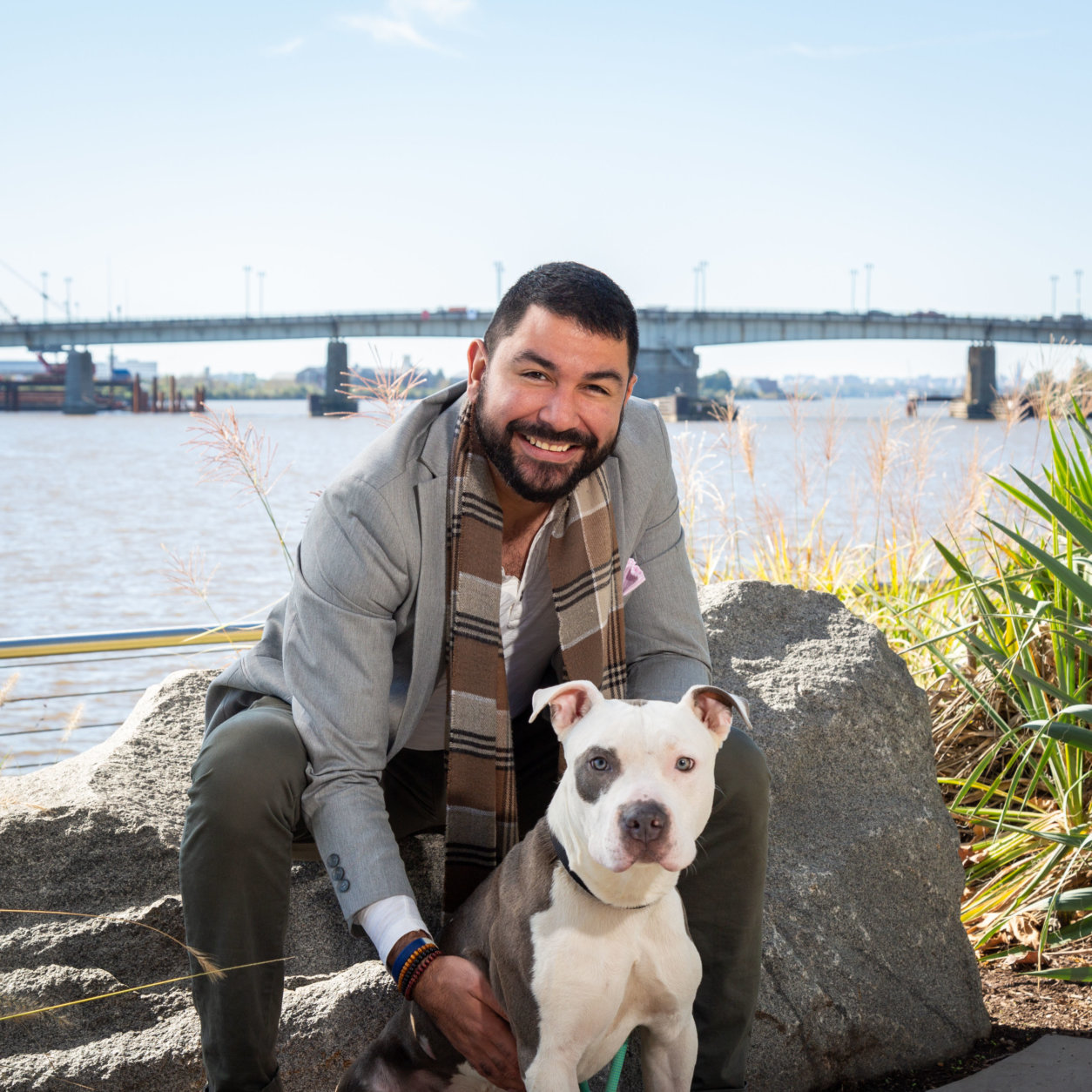 Camilo Manjarres, associate director for the Mayor’s Office of Scheduling and Advance, hangs out with Kingston, who's also available for adoption at the alliance. (Courtesy Humane Rescue Alliance)