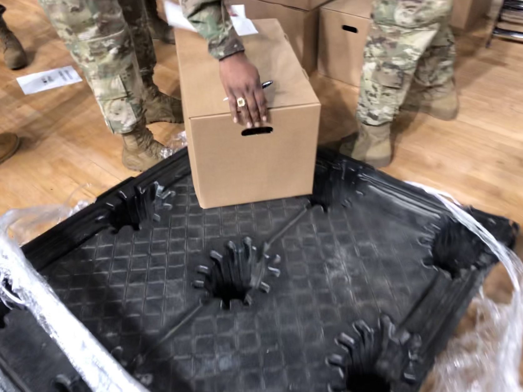 At the D.C. Armory on Monday, 17 palettes of meals were emptied with military precision. (WTOP/Kristi King)