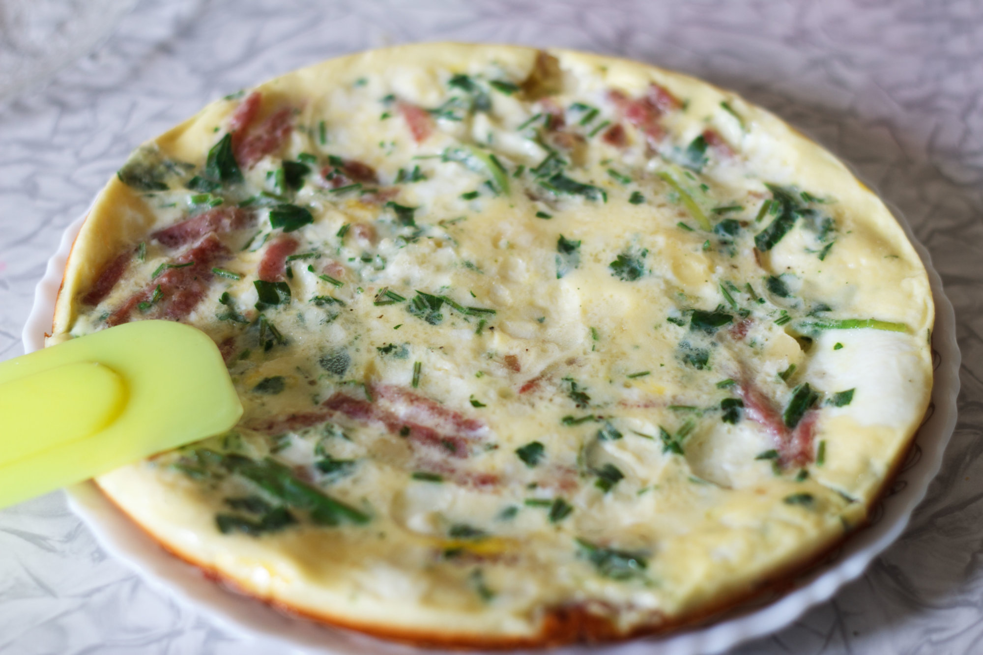magnificent hot omelet with greens and sausage for breakfast