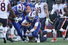 BUFFALO, NY - NOVEMBER 04: Nathan Peterman #2 of the Buffalo Bills is tackled as he runs with the ball by Roy Robertson-Harris #95 of the Chicago Bears in the third quarter during NFL game action at New Era Field on November 4, 2018 in Buffalo, New York. (Photo by Tom Szczerbowski/Getty Images)