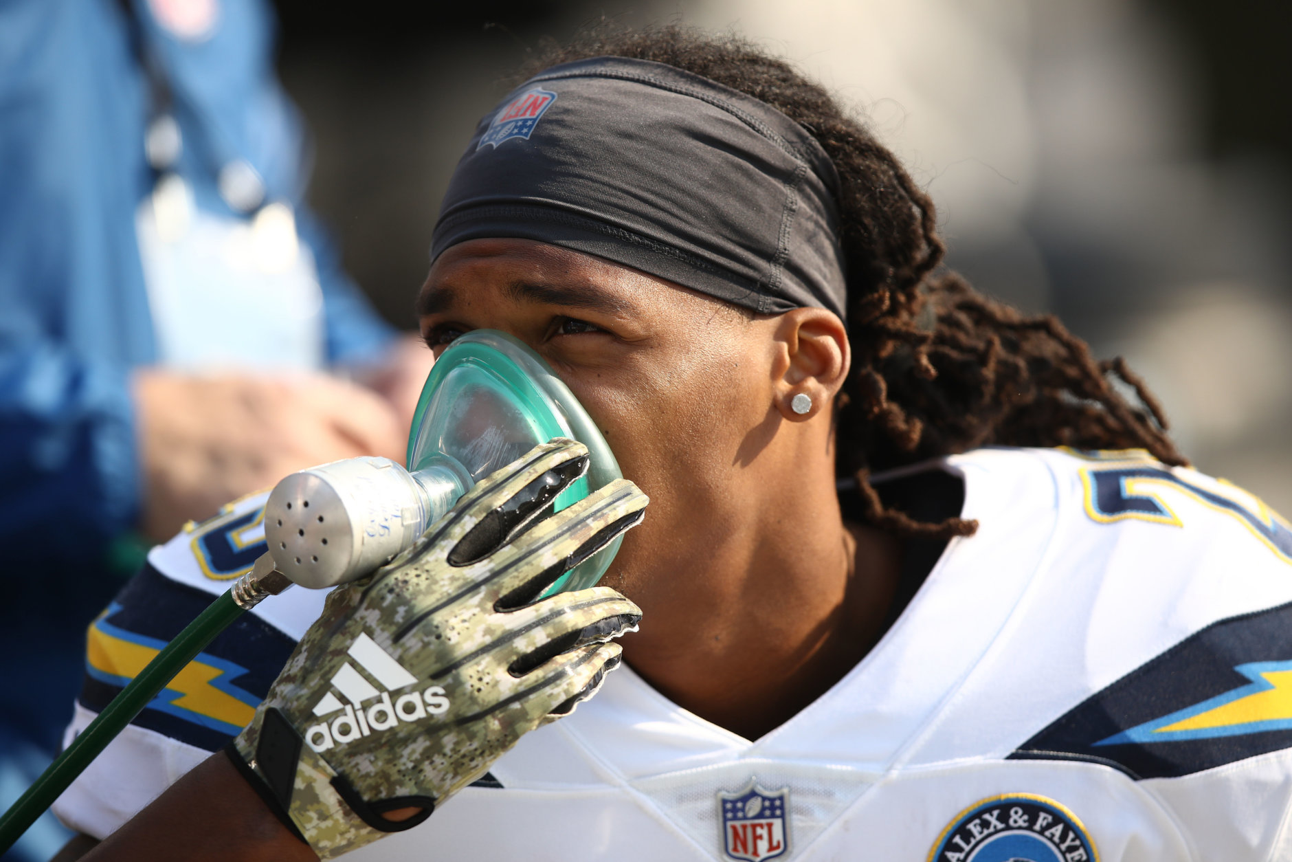 OAKLAND, CA - NOVEMBER 11: Rayshawn Jenkins #23 of the Los Angeles Chargers breathes from an oxygen tank during their NFL game against the Oakland Raiders at Oakland-Alameda County Coliseum on November 11, 2018 in Oakland, California. An Air Quality Advisory was issued due to heavy wildfire smoke in parts of the Bay Area from the Camp Fire in Butte County. (Photo by Ezra Shaw/Getty Images)