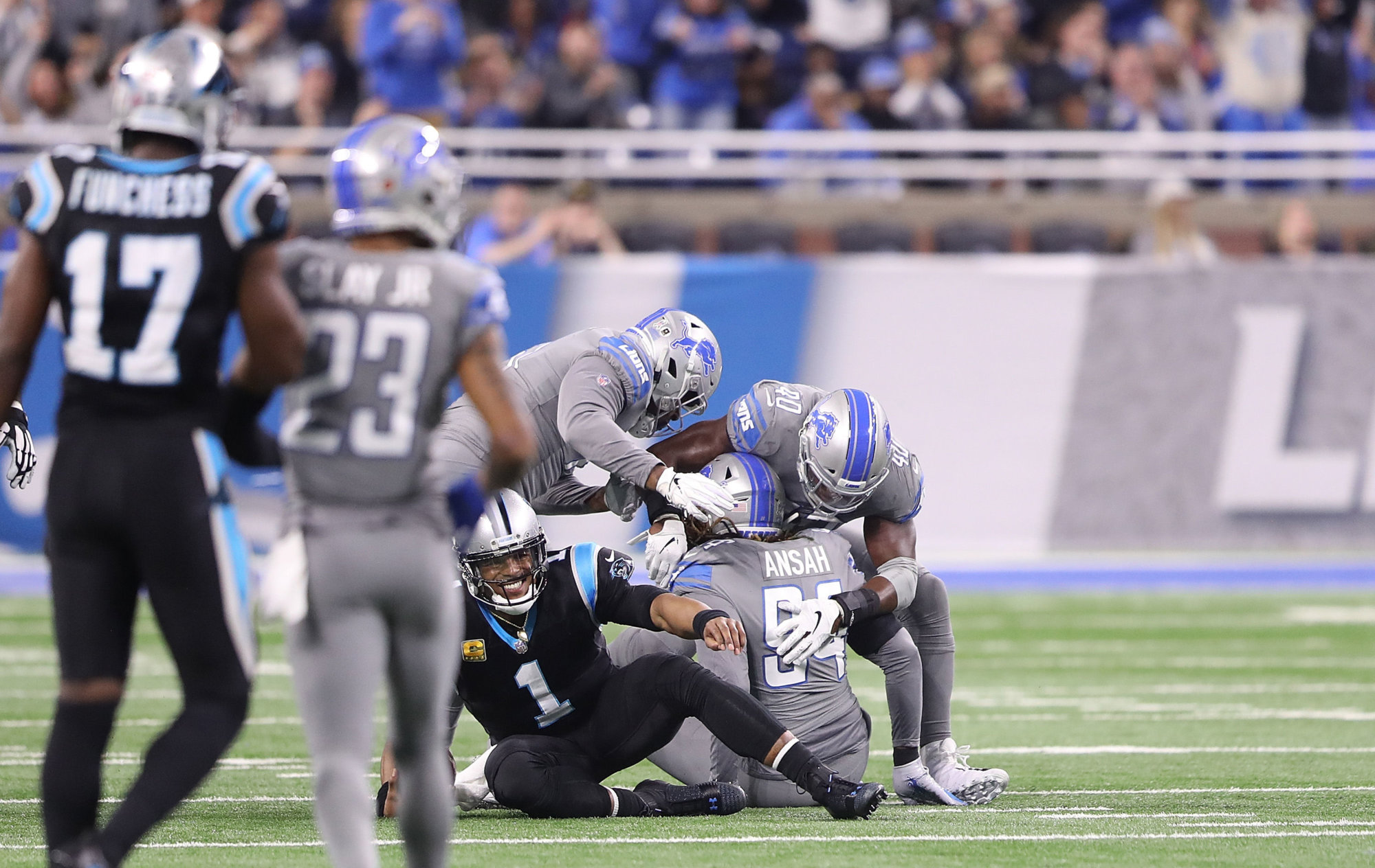 DETROIT, MI - NOVEMBER 18: Ezekiel Ansah #94 of the Detroit Lions celebrates a sack of Cam Newton #1 of the Carolina Panthers during the second quarter of the game at Ford Field on November 18, 2018 in Detroit, Michigan (Photo by Leon Halip/Getty Images)