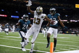 NEW ORLEANS, LOUISIANA - NOVEMBER 18: Michael Thomas #13 of the New Orleans Saints scores a touchdown  as Corey Graham #24 of the Philadelphia Eagles and Rasul Douglas #32 defends during the second half at the Mercedes-Benz Superdome on November 18, 2018 in New Orleans, Louisiana. (Photo by Jonathan Bachman/Getty Images)